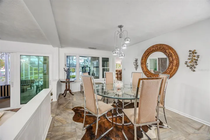 Formal dining room looks out to your pool