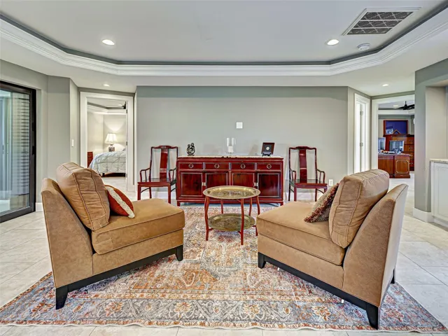 The formal living room is accentuated by a tray ceiling.