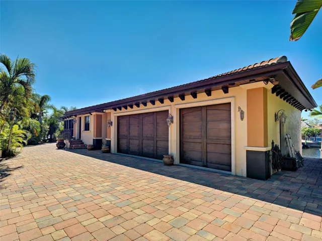 The property boasts a  cottage and an additional three-car garage