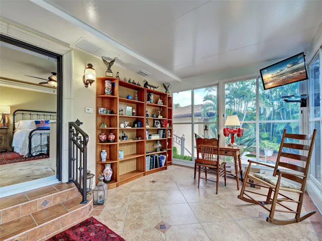 From the cottage, step into the large lanai with floor to ceiling windows.