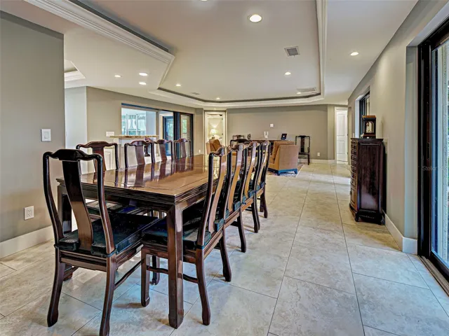 The formal dining area large enough for a table to fit 10 or more.