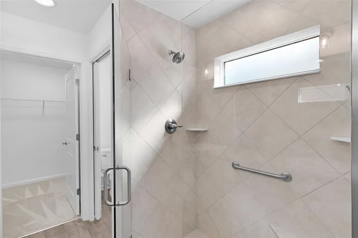 primary bath, water closrt and walk in closet