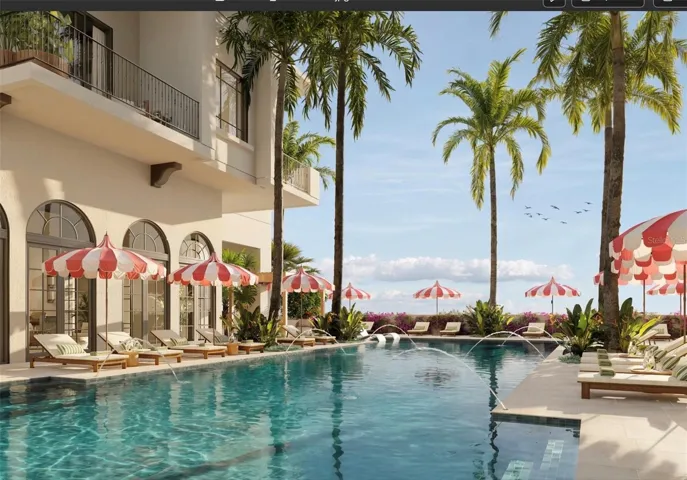 The 70-foot resort-style pool at Mira Mar is complemented by a lounging area with  a spacious sun deck, hot tub, and dedicated towel service, creating a luxurious setting for relaxation and leisure.