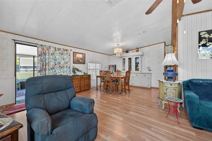 Living room looking  into dining area with Built-In China Cabinet & onto side screened  porch