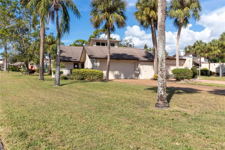 Front of villa on corner lot. Faces SW for all day light without the heat. Front gate leads to a courtyard and the front door.