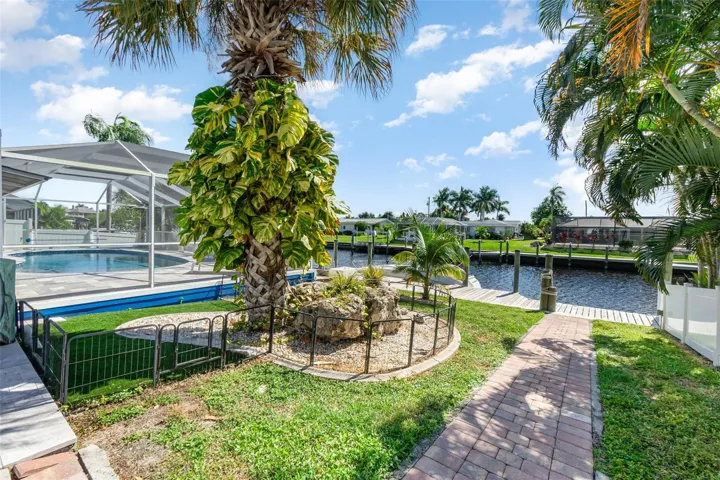 Ideal waterfront setting - step from your pool/lanai onto your canal docks and your sailboat or powerboat