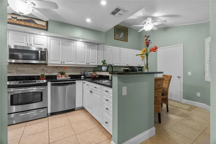 Kitchen with Granite Countertops, All Stainless Steel Appliances, and plenty of storage space