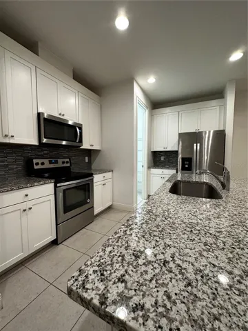 Kitchen with granite counter top - 1st Floor