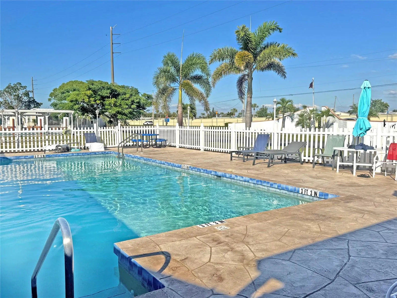 Pool with seating area.
