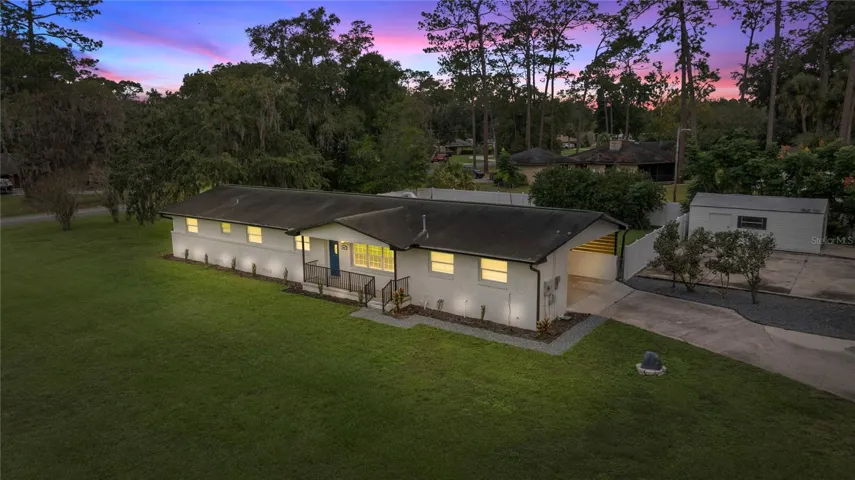 Brick Rancher with huge oversized corner lot! Side entry carport pre-wired for garage door motor if you decide you want a garage!