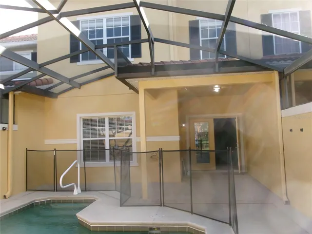 Rear covered patio, pool deck and pool