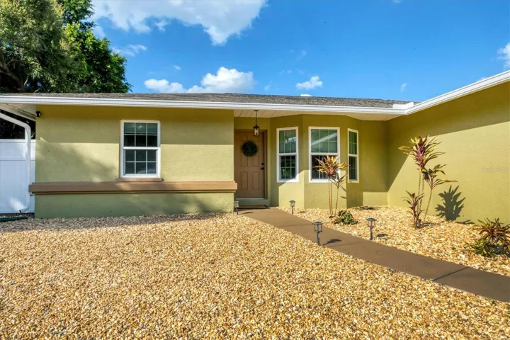 Driveway and walkway finished in colors that harmonize beautifully with the home’s style.