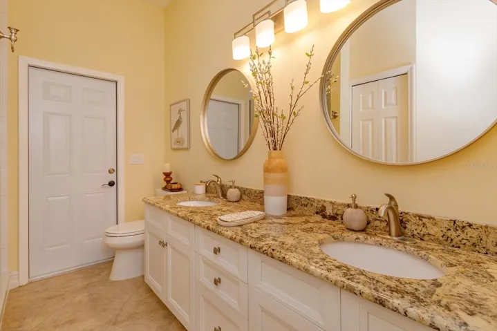 Bath number two has dual sinks, granite counters, and updated faucets.  Plenty of storage, too.