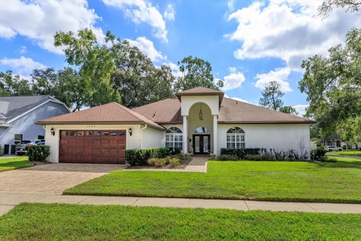 Isn't this pretty!  Well landscaped and looking fresh. Paver driveway.