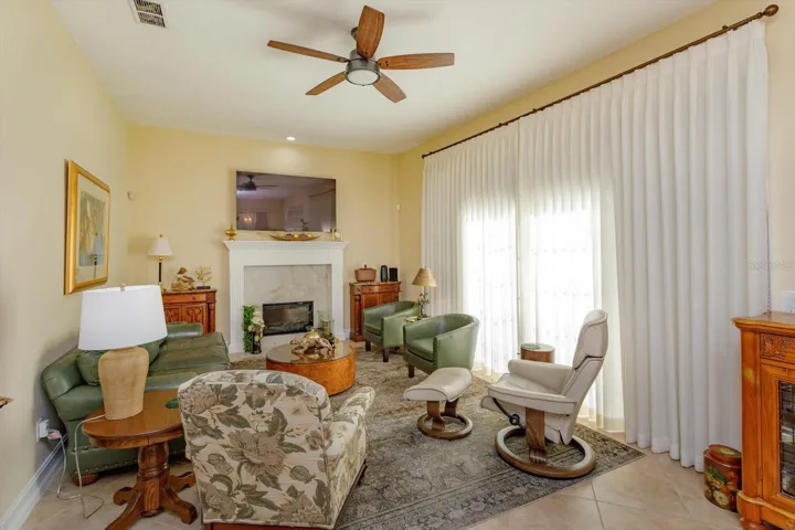 Family room has fireplace with electric insert.