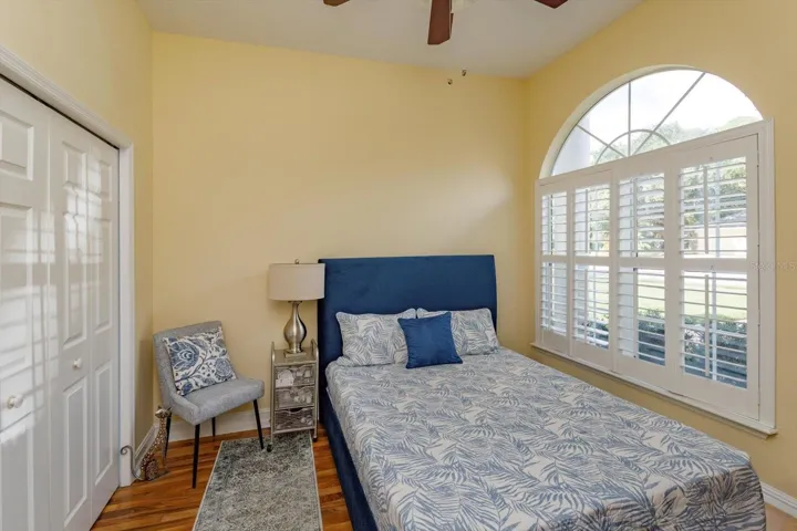 Bedroom number two has a lovely window with shutters.