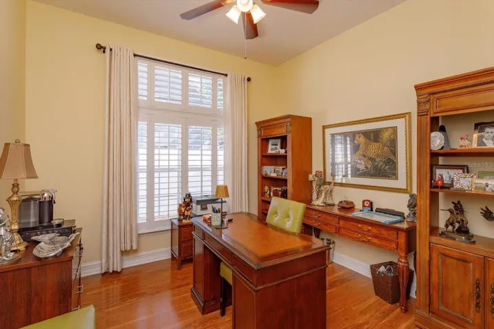 Seller uses one of the bedrooms as a home office.  Shutters on the large window.