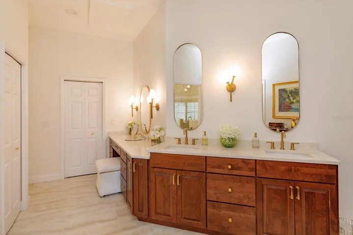 Primary bath is recently updated with beautiful stone countertops and dual sinks.