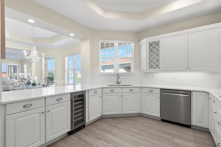 Spectacular bathed-in-light Kitchen, with endless counter space, Kitchen-Aid appliances and ample storage.