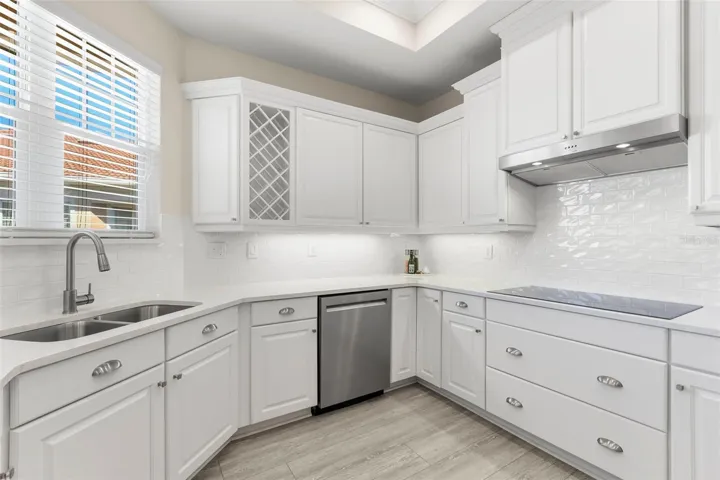 36" induction Kitchen-Aid cooktop, under cabinet lighting.