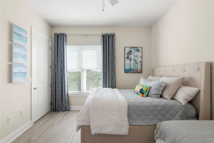 Guest Bedroom 3, with large walk-in closet, blackout window treatments and Jack-n-Jill Bath.