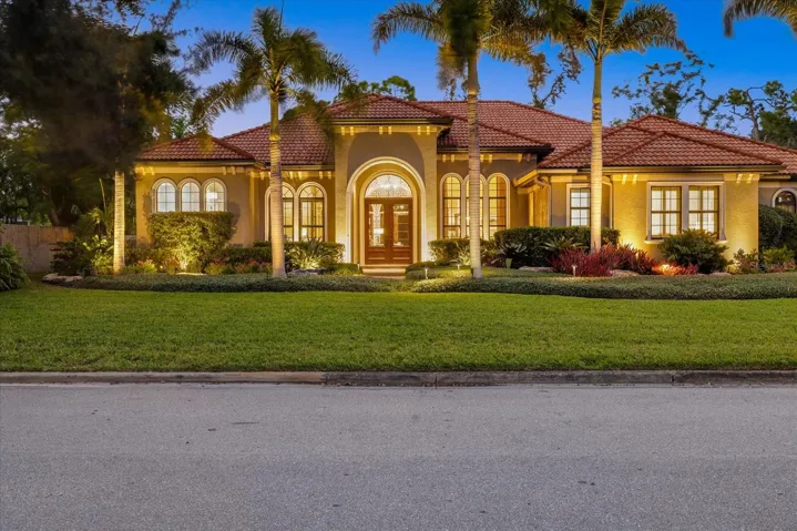 Exquisite front elevation with landscape lighting