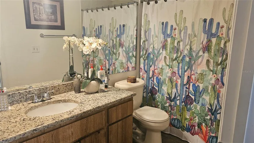Guest Bathroom with granite and shower and tub