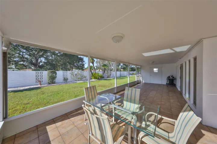 COVERED SCREENED LANAI WITH PRIVATE BACKYARD VIEW