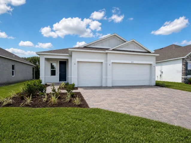 Stunning Exterior - Block Construction, landscaping, entry & driveway pavers, 3 car garage