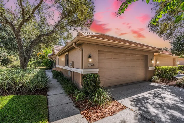 Front Exterior - New Tile Roof- 3 bedrooms/2 bathrooms/2 car garage overlooking a pond.