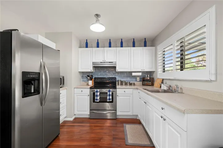Updated stainless steel appliances, plantation shutters and LVP flooring!