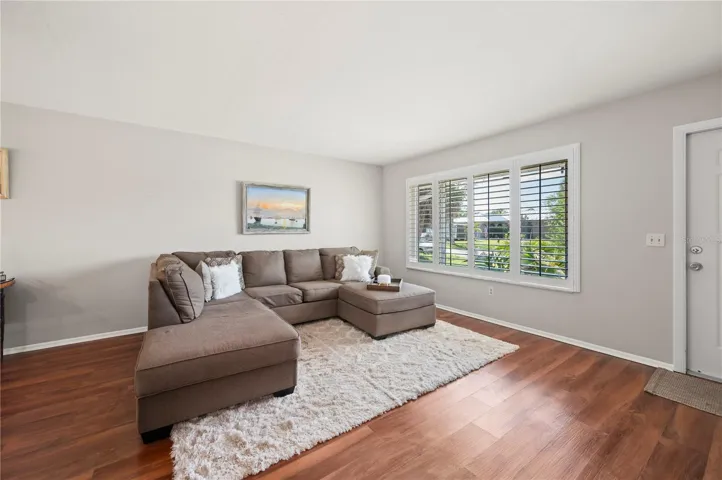 New front impact window, plantation shutters, and LVP flooring!