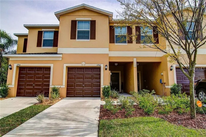 Built 2018 Townhome with 1 Car Garage, Driveway and Covered Entry.
