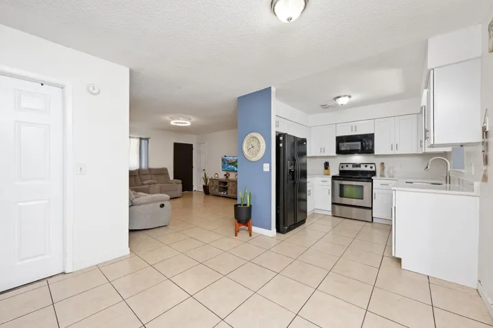 Updated kitchen, versatile living spaces, a split bedroom layout, and tile floors throughout!