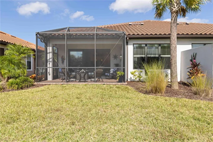 Backview of home with concrete privacy fence