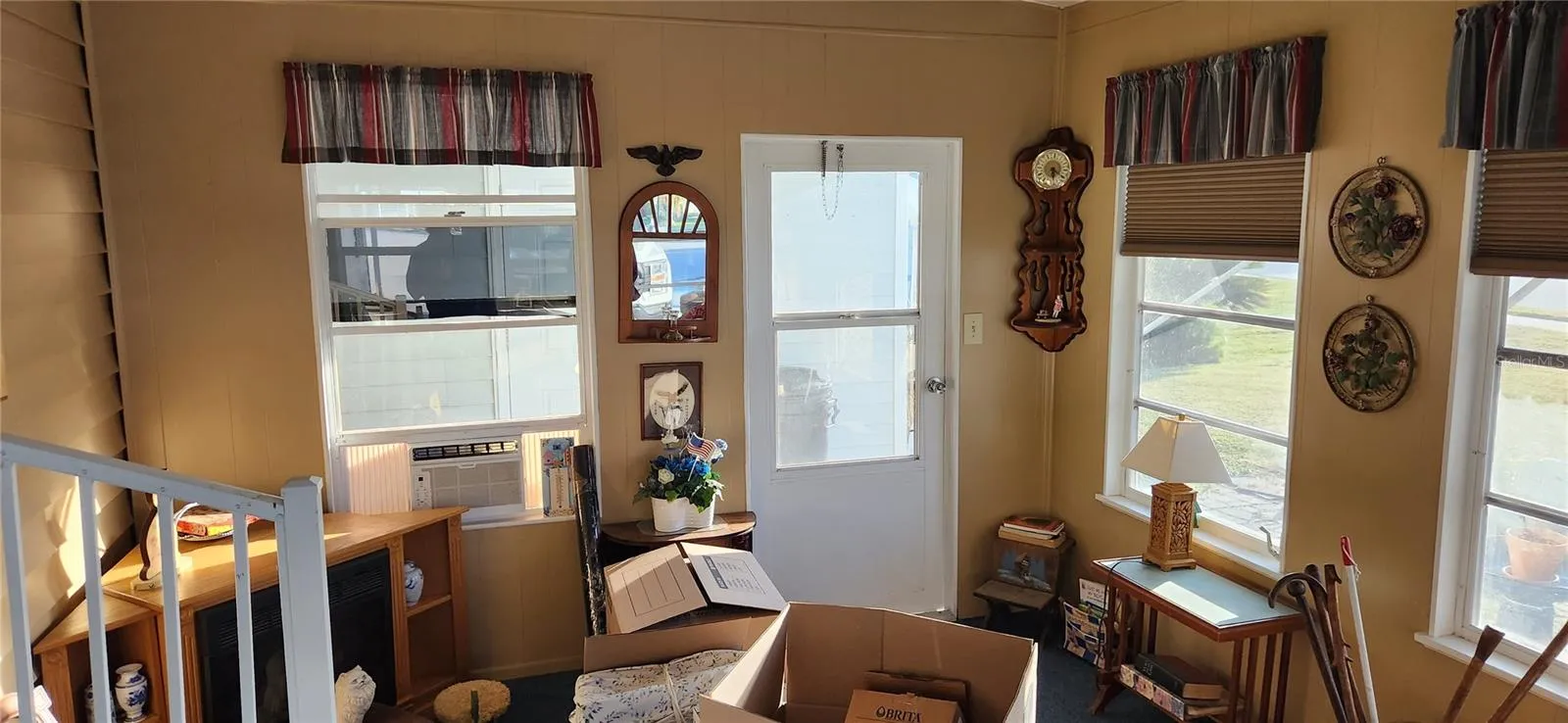 Florida room with separate AC unit, door to laundry room