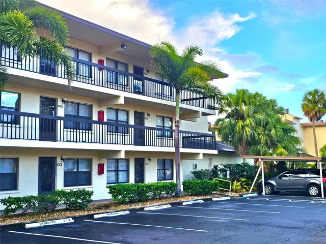 Front of condo and designated parking space