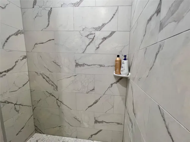 Full-height tiled walk-in shower