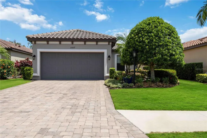Welcome to the Roma, a beautifully crafted single-family home by Taylor Morrison in Esplanade Golf & Country Club, where timeless architecture meets resort-style living in one of Lakewood Ranch’s most sought-after communities.