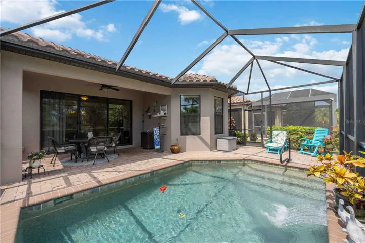 Another angle of this stunning backyard oasis with more room to relax with extra space for lounge chairs.