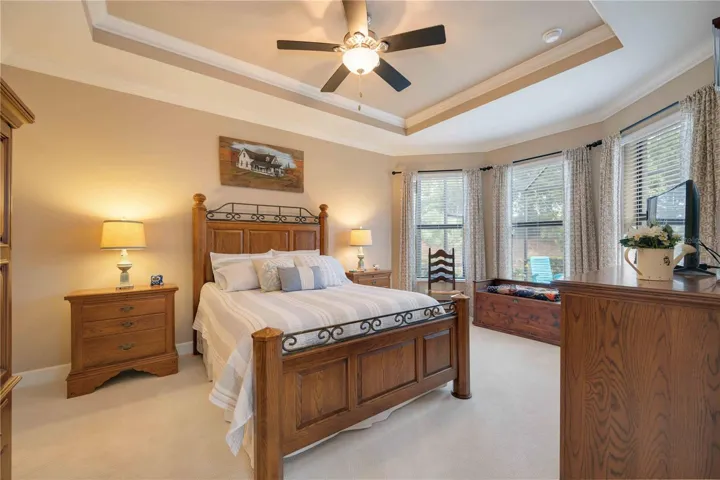 Retreat to the expansive primary suite, complete with room for a king-sized bed and additional furnishings.