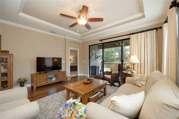Plenty of wall space for a large TV and convenient access to the primary suite off the living room.
