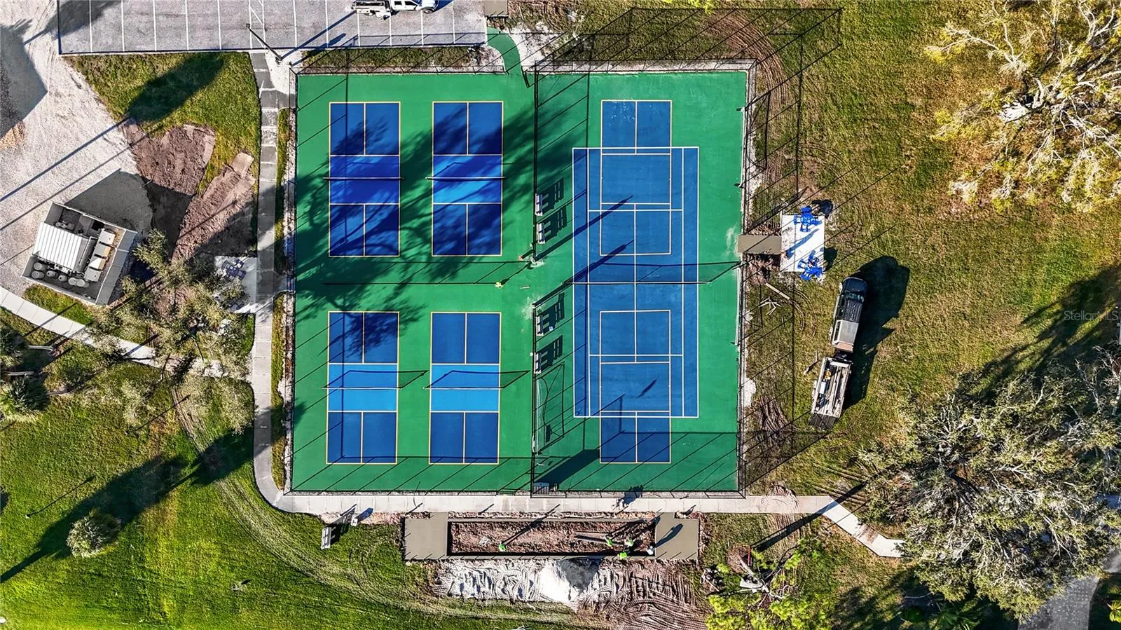 Overhead of Pickleball and Tennis Courts, bottom of picture shows Bocce Court under construction.