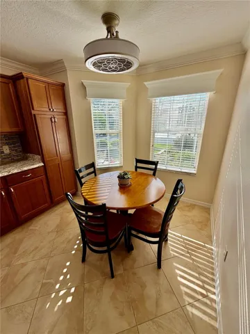 Kitchen nook, with new fan and crown molding