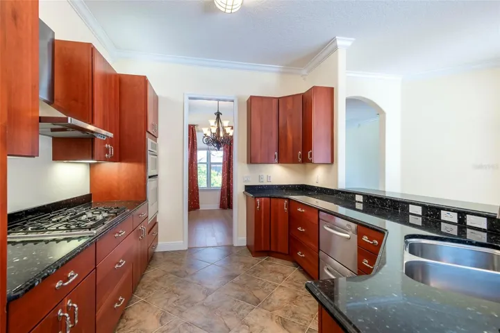 Kitchen looking from family room toward dining room. Check out the glass-paneled pocket door.