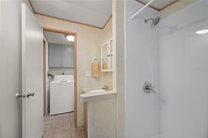 Bathroom 1 is spacious and features a BathFitter shower