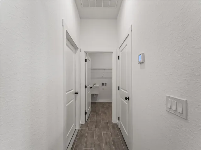 Hallway to Interior Laundry and Garage