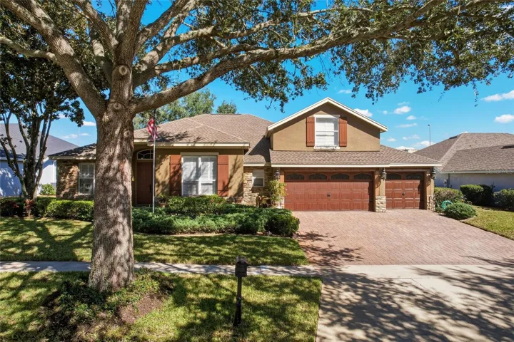 Welcome Home to your brick paver driveway, 3 car garage, and double front door entry
