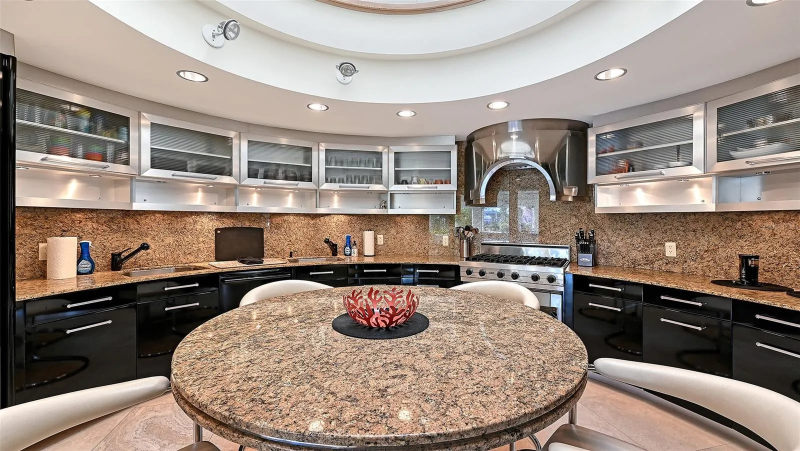 Two Story circular kitchen with stainless steel upper cabinetry