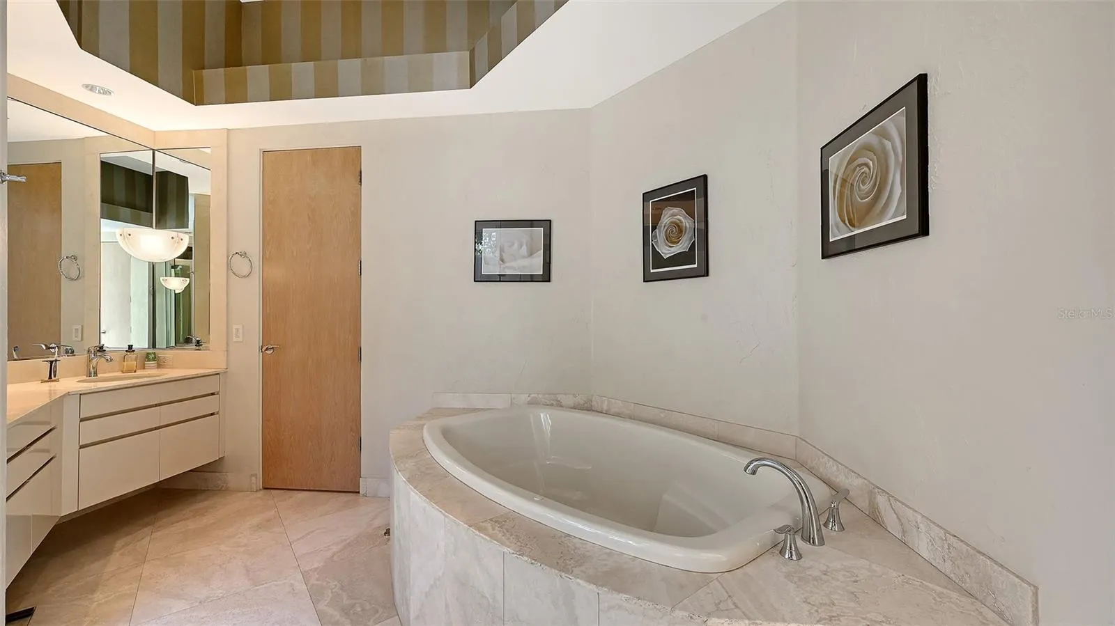 Soaking tub completes the primary bathroom, providing the perfect spot to unwind and relax